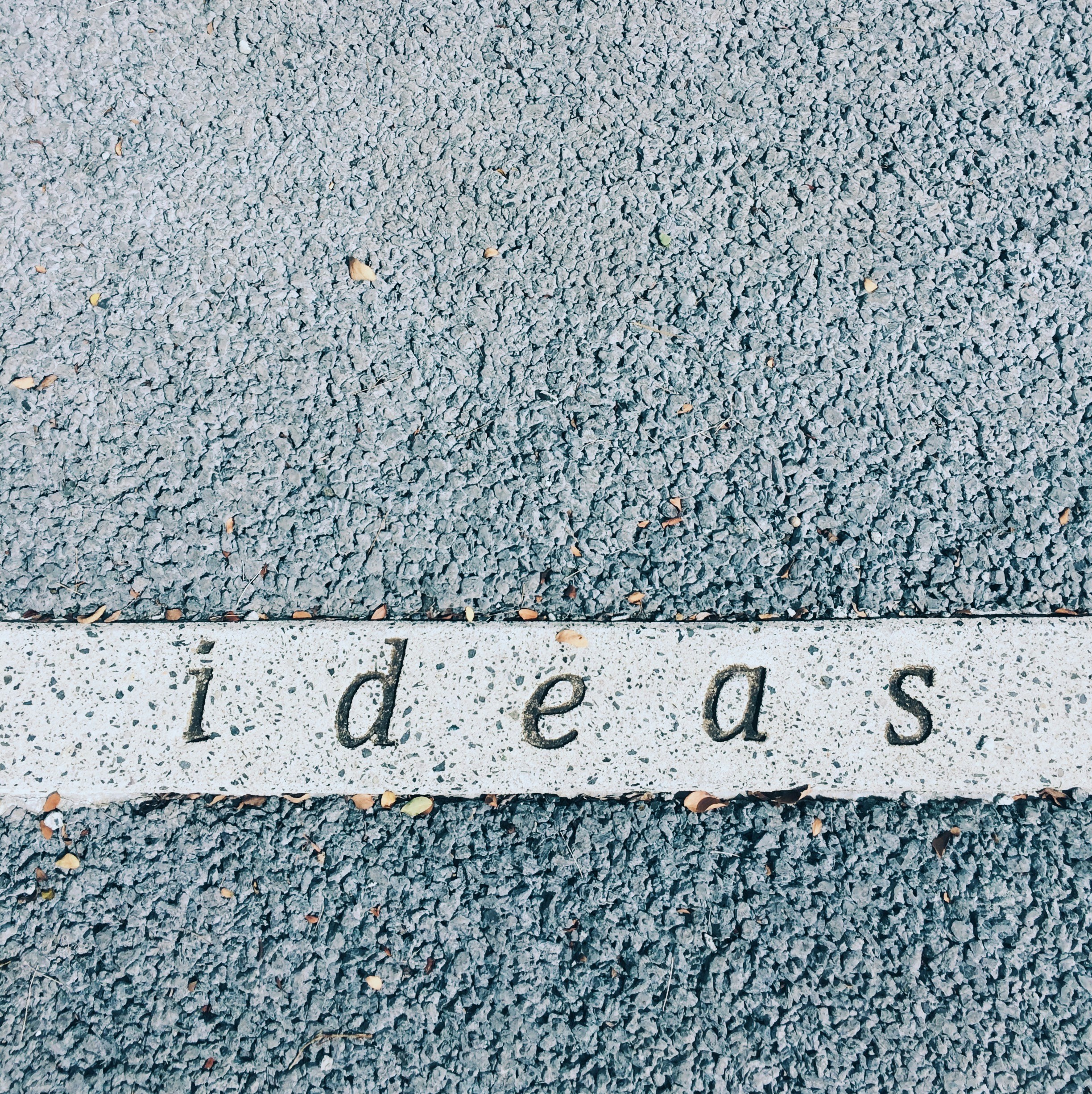 ideas carved on concrete surface